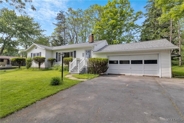1701 Billington Rd, Elma, NY 14052 - single story home featuring asphalt driveway, a front yard, a chimney, and a garage