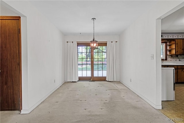 1701 Billington Rd, Elma, NY 14052 - unfurnished dining area featuring light colored carpet and baseboards