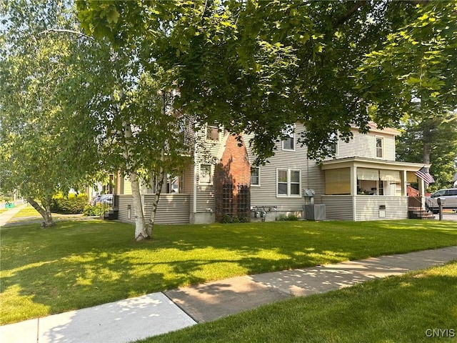 700 Elm St, Rome-Inside, NY 13440 - view of property hidden behind natural elements with a front lawn and cooling unit