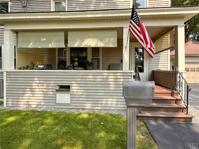 700 Elm St, Rome-Inside, NY 13440 - back of property with covered porch and a lawn