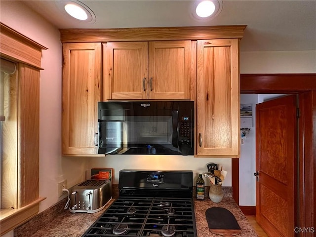 700 Elm St, Rome-Inside, NY 13440 - kitchen with black microwave and gas range