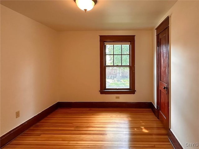 700 Elm St, Rome-Inside, NY 13440 - spare room with wood finished floors and baseboards