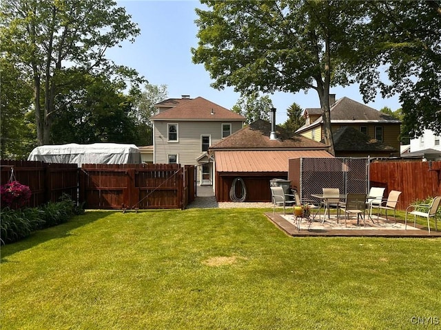 700 Elm St, Rome-Inside, NY 13440 - back of house with a patio area