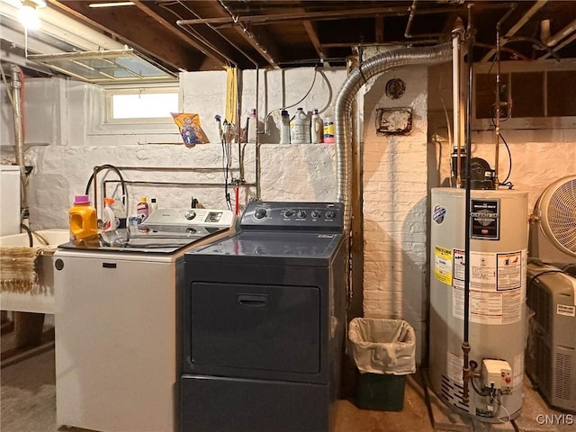 700 Elm St, Rome-Inside, NY 13440 - laundry area with washer and dryer and water heater