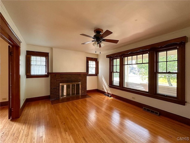700 Elm St, Rome-Inside, NY 13440 - unfurnished living room featuring baseboards, light wood-type flooring, a fireplace, and a ceiling fan