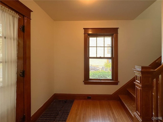 700 Elm St, Rome-Inside, NY 13440 - stairway with wood-type flooring and baseboards