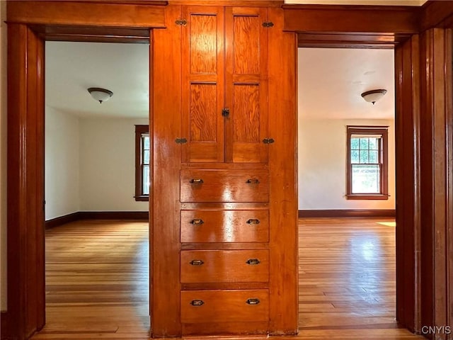 700 Elm St, Rome-Inside, NY 13440 - corridor featuring light wood finished floors and baseboards