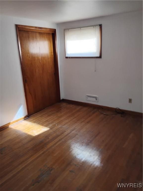 72 Nicholson St, Buffalo, NY 14214 - unfurnished bedroom with wood finished floors and a closet