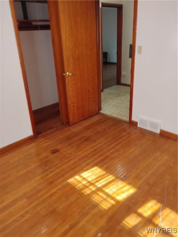 72 Nicholson St, Buffalo, NY 14214 - unfurnished bedroom featuring wood finished floors and a closet