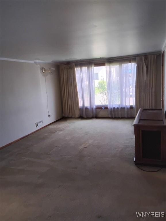 72 Nicholson St, Buffalo, NY 14214 - unfurnished living room featuring carpet floors and baseboards