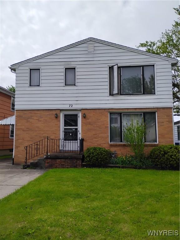 72 Nicholson St, Buffalo, NY 14214 - view of front facade with a front yard and brick siding