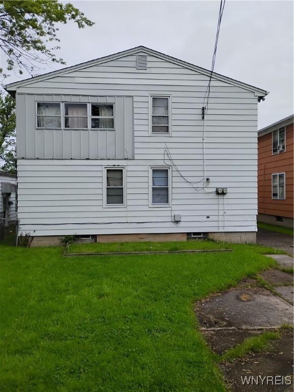 72 Nicholson St, Buffalo, NY 14214 - back of property with a lawn and board and batten siding