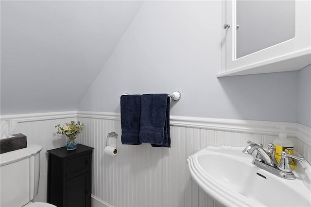 707 Hubbell Rd, Ogden, NY 14428 - bathroom featuring a sink, wainscoting, and toilet