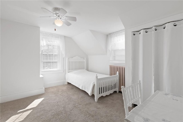 707 Hubbell Rd, Ogden, NY 14428 - carpeted bedroom with radiator, lofted ceiling, and ceiling fan