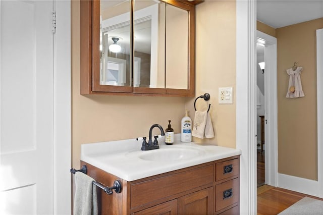 707 Hubbell Rd, Ogden, NY 14428 - bathroom with vanity and wood finished floors