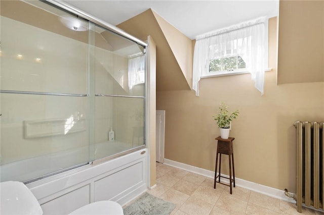 707 Hubbell Rd, Ogden, NY 14428 - full bath featuring radiator heating unit, toilet, combined bath / shower with glass door, tile patterned floors, and baseboards