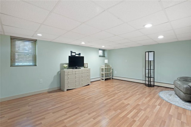 707 Hubbell Rd, Ogden, NY 14428 - basement featuring light wood-style flooring, a drop ceiling, baseboards, and recessed lighting