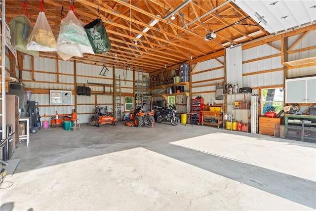 707 Hubbell Rd, Ogden, NY 14428 - garage with metal wall and a garage door opener