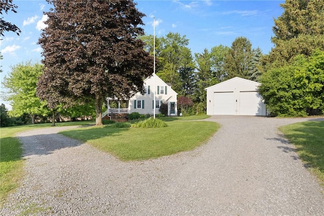 707 Hubbell Rd, Ogden, NY 14428 - view of front of home with an outbuilding, a detached garage, a front lawn, and gravel driveway