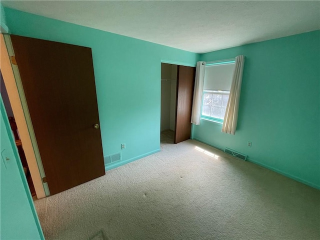 235 Briarwood Ln, Wheatland, NY 14546 - unfurnished bedroom with carpet, a closet, and baseboards
