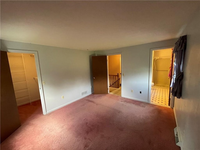 235 Briarwood Ln, Wheatland, NY 14546 - unfurnished bedroom featuring a spacious closet, carpet flooring, baseboards, a closet, and connected bathroom