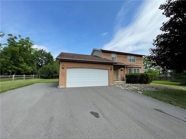 235 Briarwood Ln, Wheatland, NY 14546 - traditional-style house with an attached garage and driveway