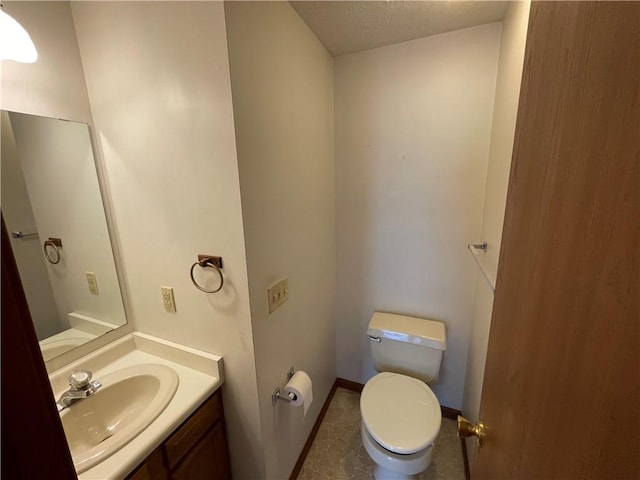 235 Briarwood Ln, Wheatland, NY 14546 - bathroom with toilet, vanity, baseboards, and a textured ceiling