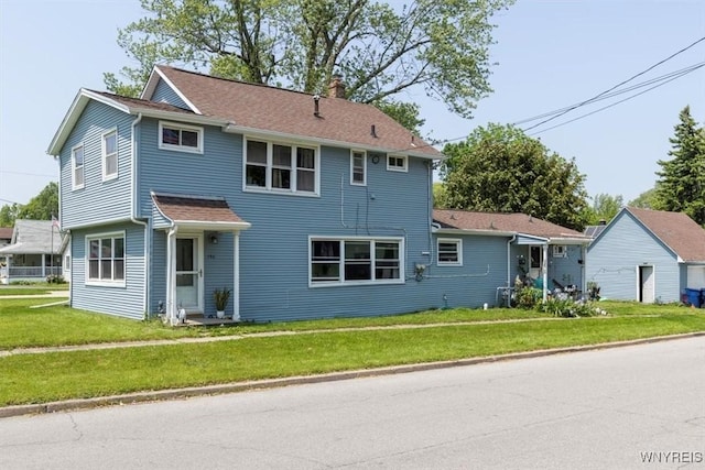 596 Longmeadow Rd, Amherst, NY 14226 - view of front facade featuring a front lawn and a chimney