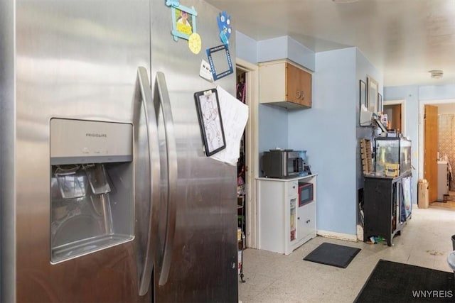 596 Longmeadow Rd, Amherst, NY 14226 - kitchen with stainless steel refrigerator with ice dispenser, tile patterned floors, and baseboards