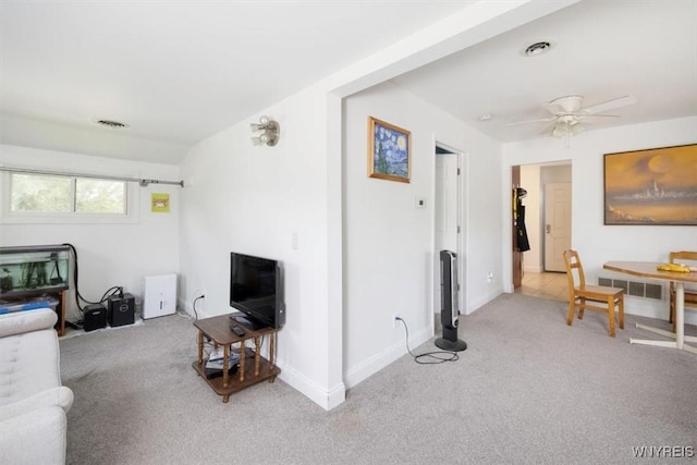 596 Longmeadow Rd, Amherst, NY 14226 - living room with light carpet, ceiling fan, and baseboards