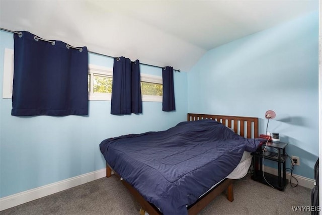 596 Longmeadow Rd, Amherst, NY 14226 - bedroom featuring vaulted ceiling, baseboards, and carpet