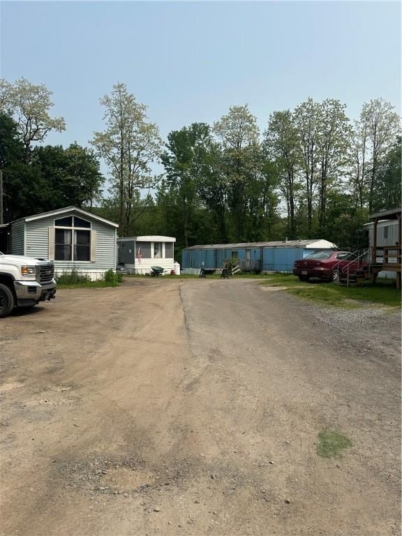 28 Main St, Unadilla, NY 13849 - view of front of home featuring view of wooded area