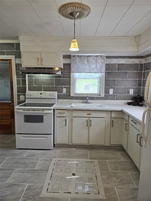 30 Park Ave, Eldred, PA 16731 - kitchen with white appliances, under cabinet range hood, a sink, and light countertops