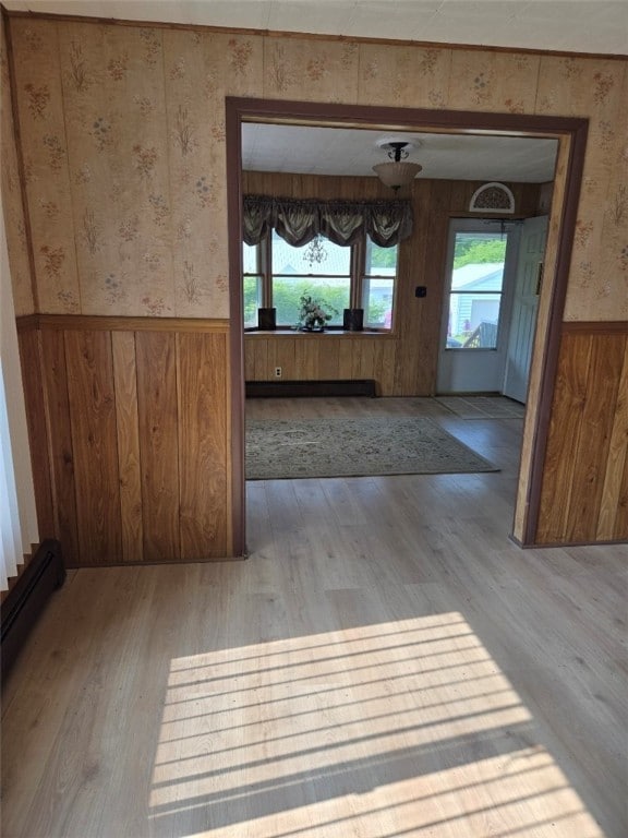30 Park Ave, Eldred, PA 16731 - unfurnished dining area featuring wallpapered walls, a wainscoted wall, wood finished floors, and wood walls