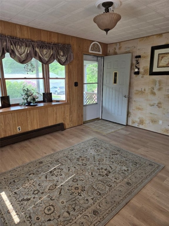 30 Park Ave, Eldred, PA 16731 - entryway with baseboard heating, wood finished floors, and wooden walls