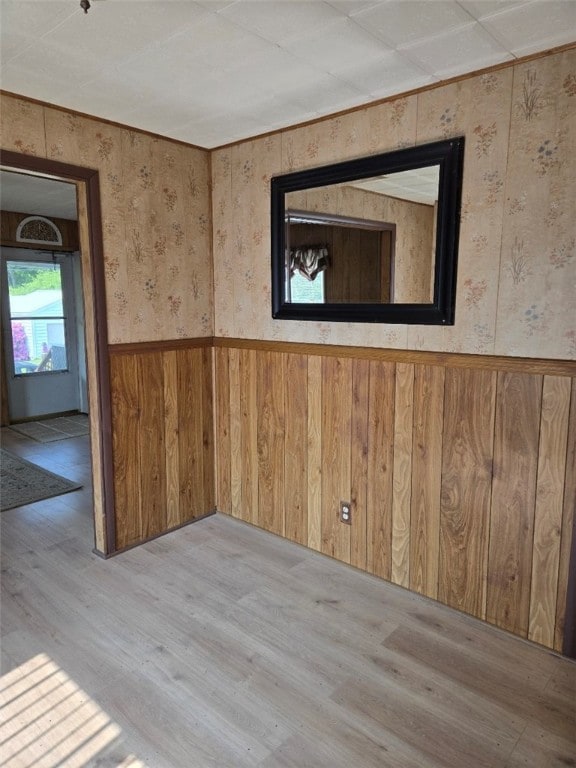 30 Park Ave, Eldred, PA 16731 - empty room featuring wood finished floors, wallpapered walls, wainscoting, and wood walls