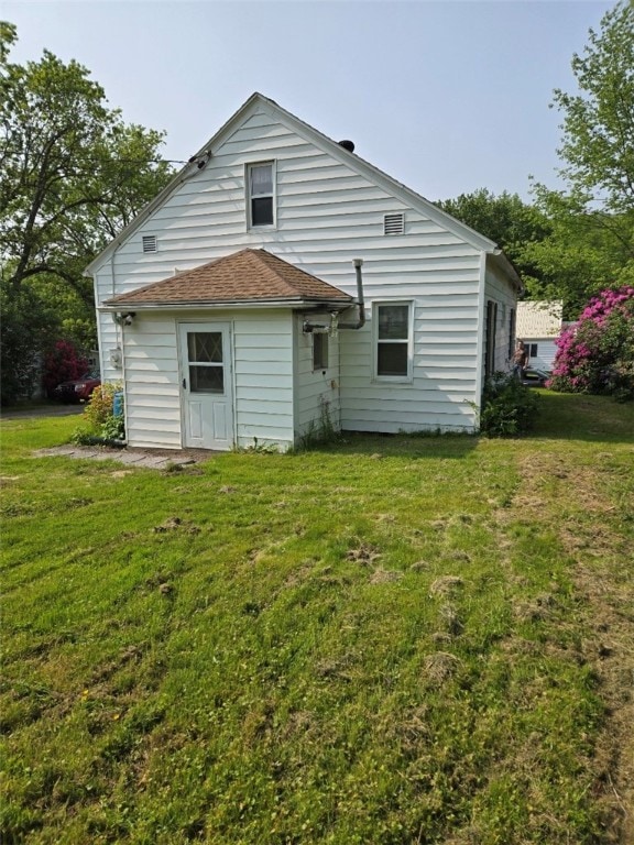 30 Park Ave, Eldred, PA 16731 - rear view of house featuring a lawn and roof with shingles