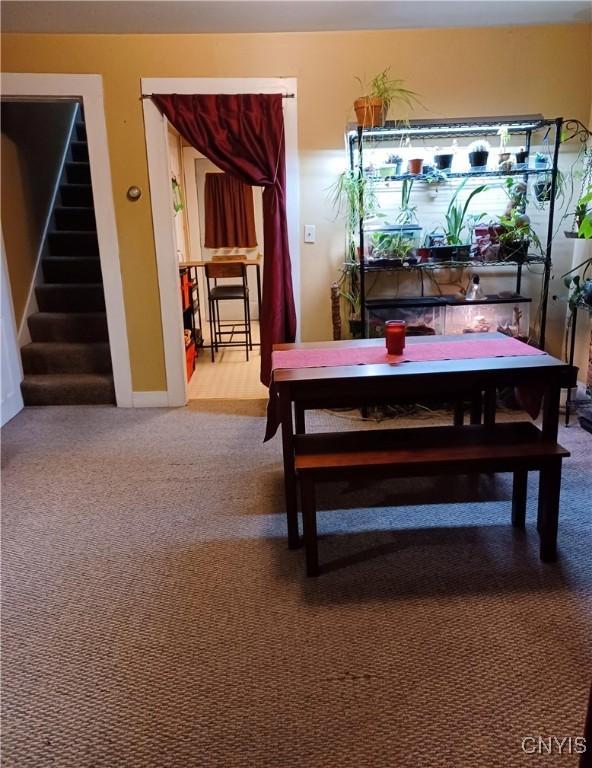 58-60 Lansing St, Auburn, NY 13021 - dining area with stairway and carpet flooring