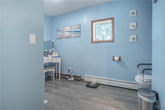 18916 State Route 3, Hounsfield, NY 13601 - bathroom with a baseboard heating unit, toilet, and wood finished floors