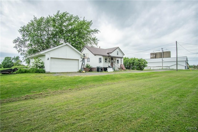 18916 State Route 3, Hounsfield, NY 13601 - view of front of property featuring a garage, a front lawn, and board and batten siding