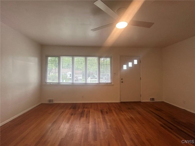719 Dawes Ave, Utica, NY 13502 - unfurnished room featuring wood finished floors, ceiling fan, and baseboards
