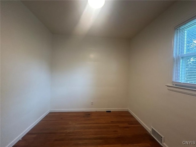 719 Dawes Ave, Utica, NY 13502 - unfurnished room with dark wood-type flooring and baseboards
