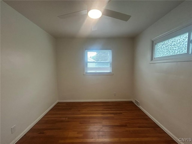 719 Dawes Ave, Utica, NY 13502 - spare room featuring healthy amount of natural light, ceiling fan, wood finished floors, and baseboards