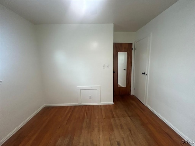 719 Dawes Ave, Utica, NY 13502 - empty room featuring wood finished floors and baseboards