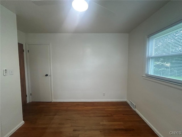 719 Dawes Ave, Utica, NY 13502 - empty room featuring wood finished floors and baseboards