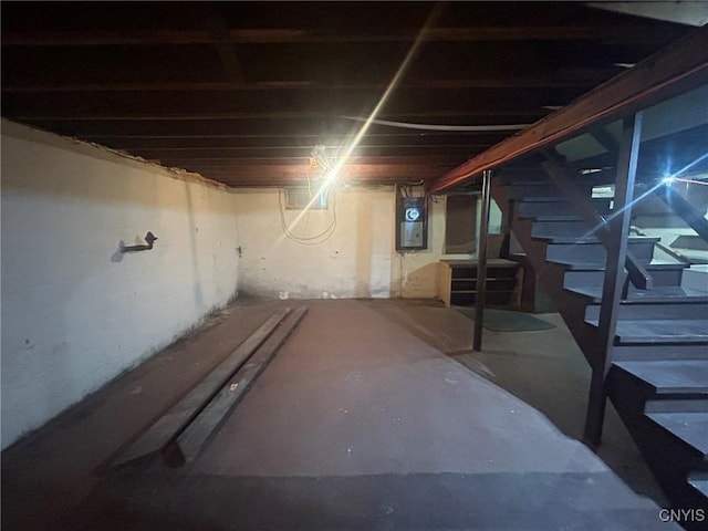 719 Dawes Ave, Utica, NY 13502 - unfinished basement featuring stairs and electric panel