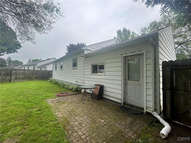 719 Dawes Ave, Utica, NY 13502 - rear view of house featuring a patio