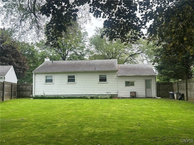 719 Dawes Ave, Utica, NY 13502 - rear view of house featuring a chimney and roof with shingles