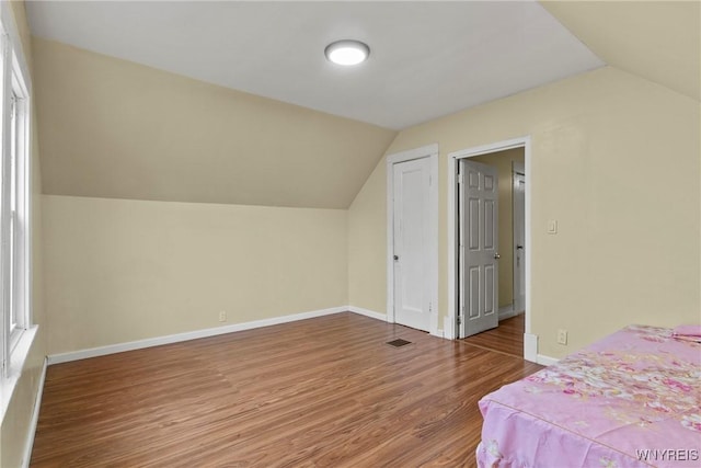 159 Kilhoffer St, Buffalo, NY 14211 - bedroom with lofted ceiling, wood finished floors, and baseboards