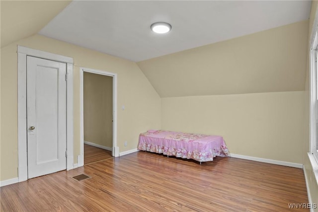 159 Kilhoffer St, Buffalo, NY 14211 - bedroom featuring vaulted ceiling, light wood-style flooring, and baseboards
